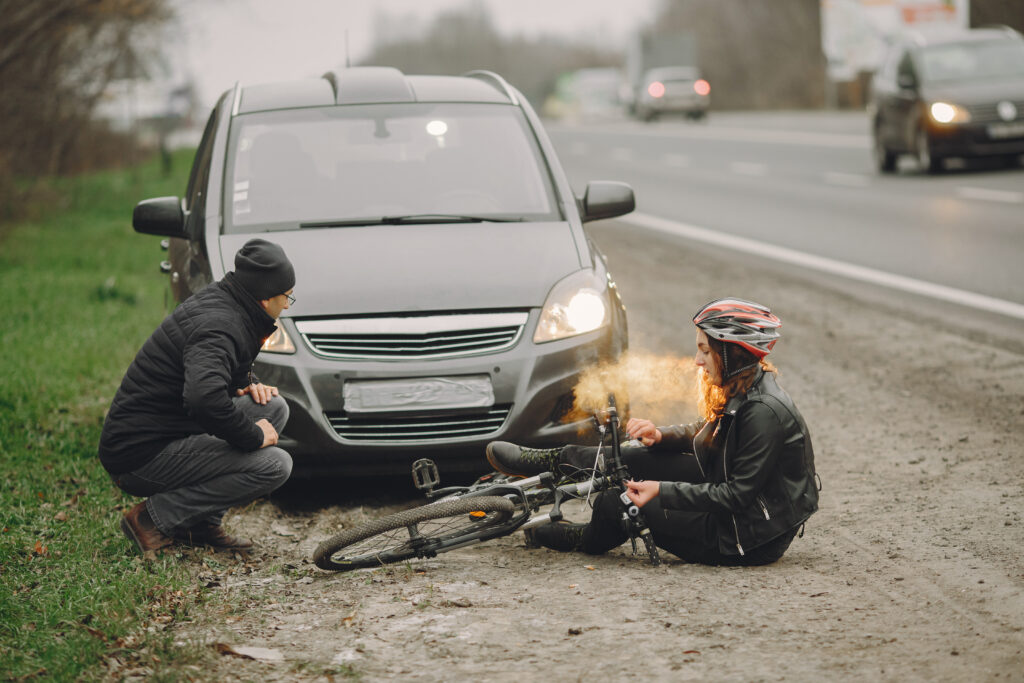 Road accident with cyclist man driver and car