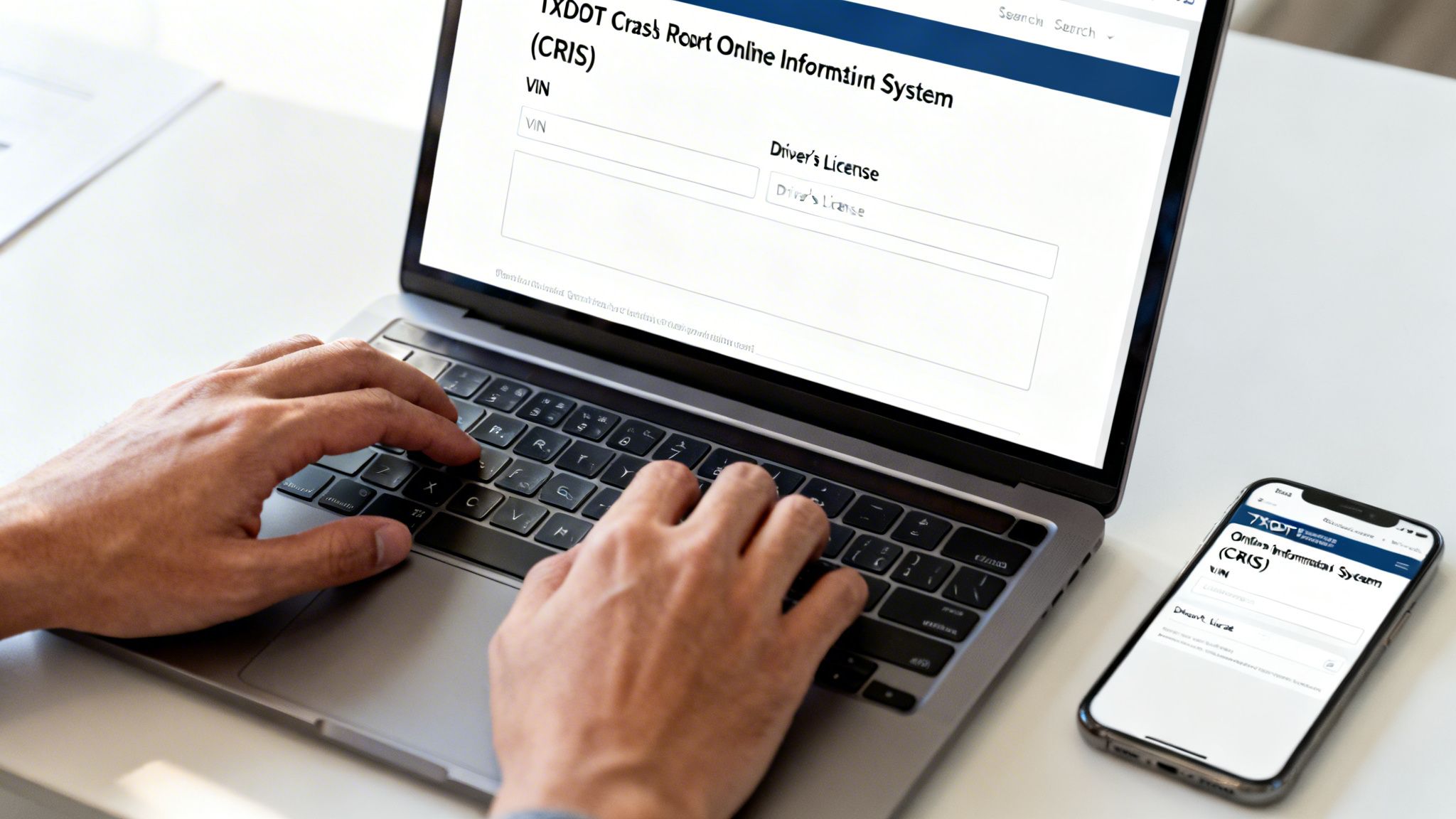Person typing on a laptop and smartphone displaying a TXDOT crash report online system.